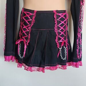 Tripp NYC Black Mini Skirt with Pink Lace-Up and Chains